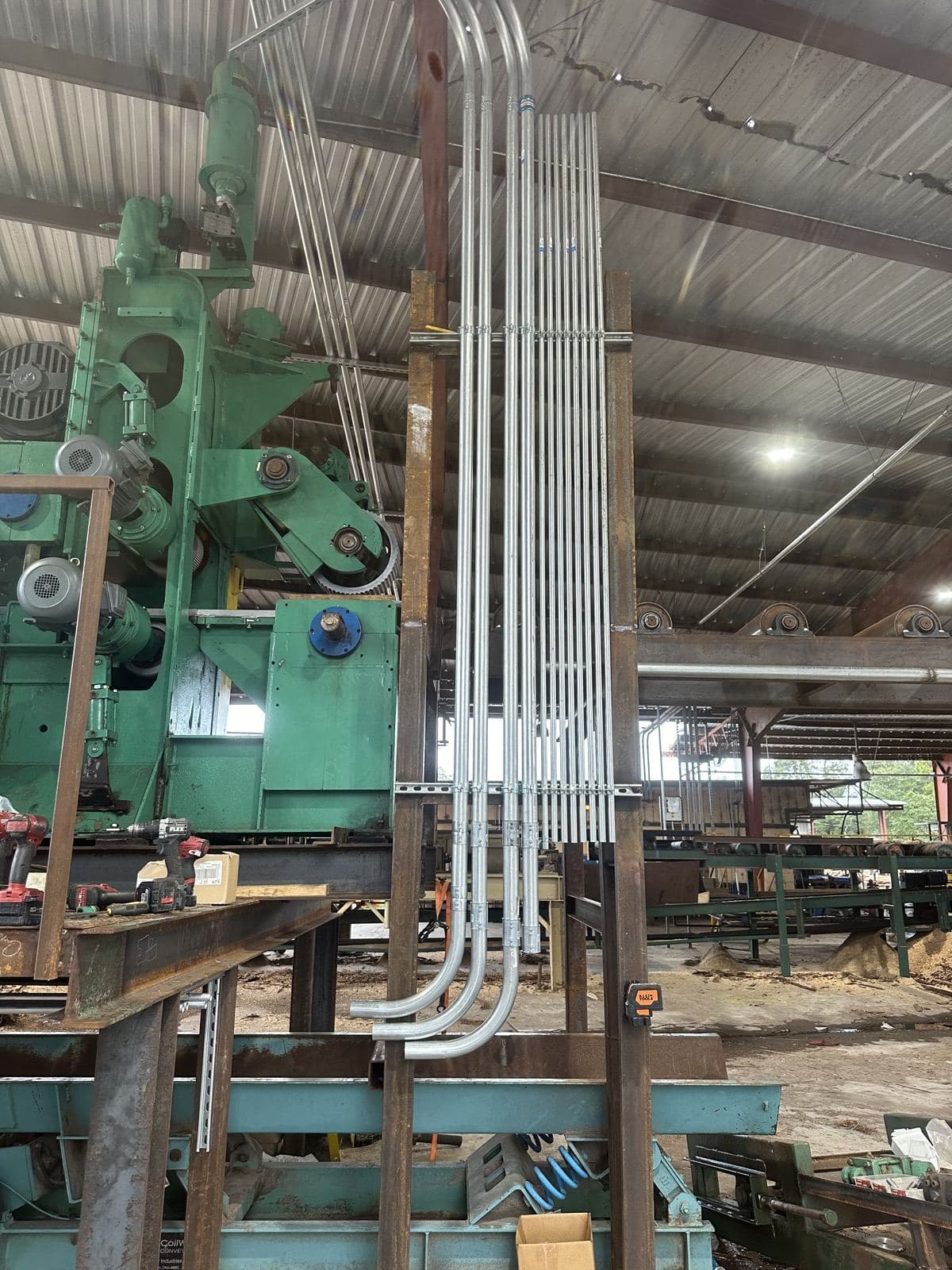 Rows of conduit run to industrial equipment